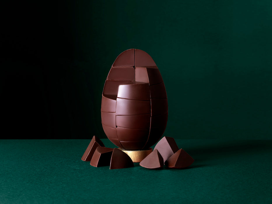 Unpackaged Belgian Dark Mint Egg on a rich green background